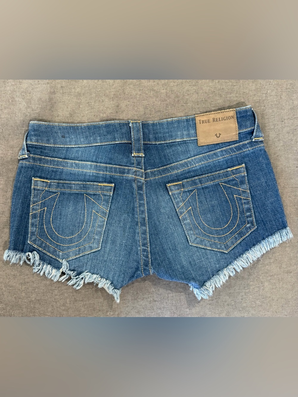 True Religion Medium Blue Distressed Denim low rise Cutoff Shorts